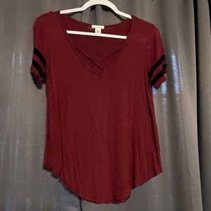 Maroon shirt with cross in front